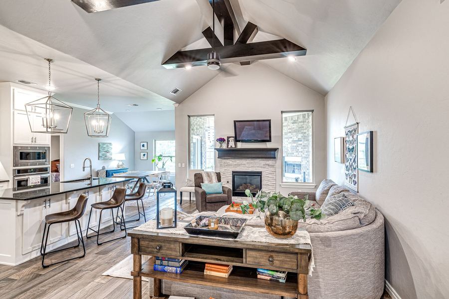 Open living room and kitchen with a beamed ceiling